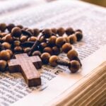 rosary on open bible